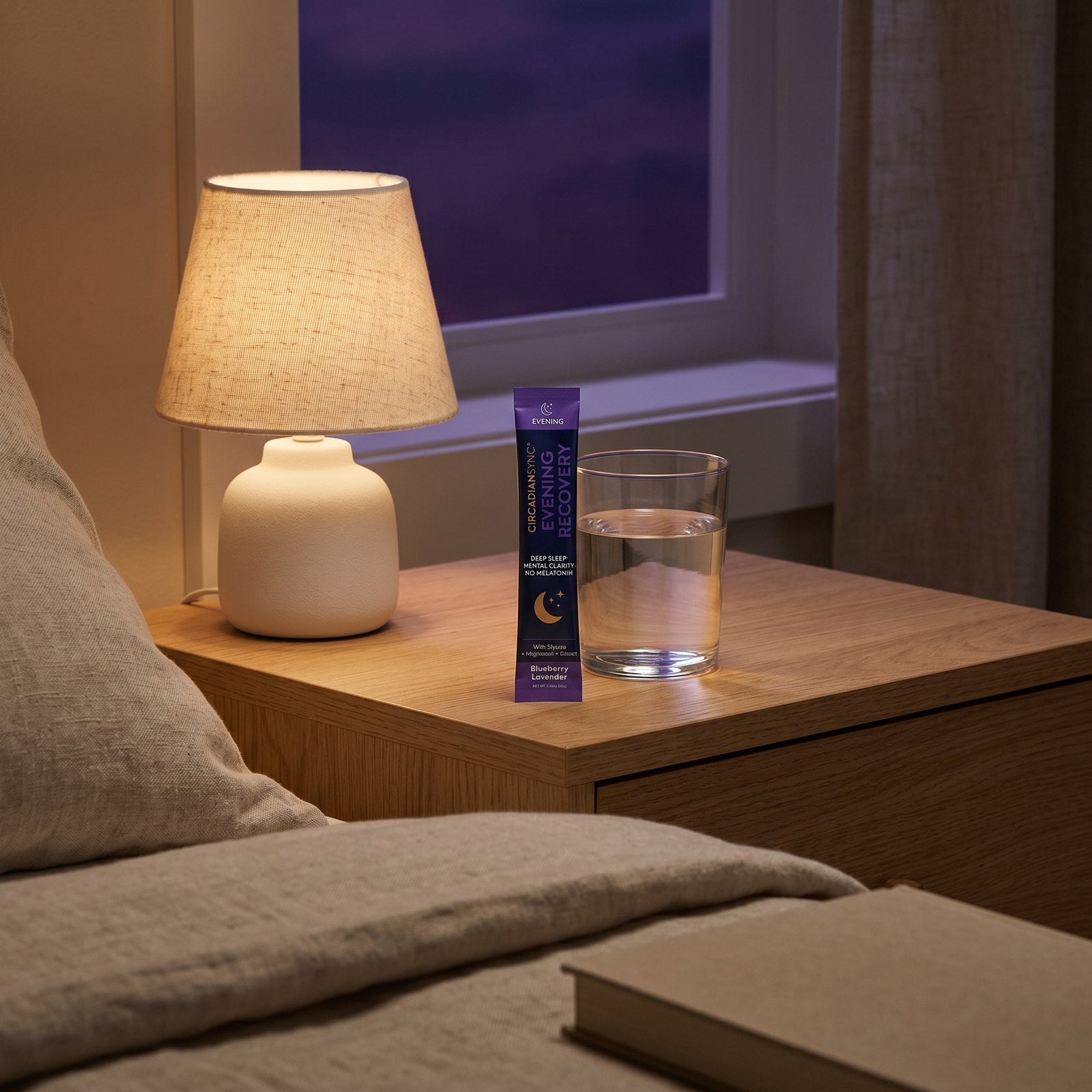 Evening Recovery stick pack on a nightstand in warm low light